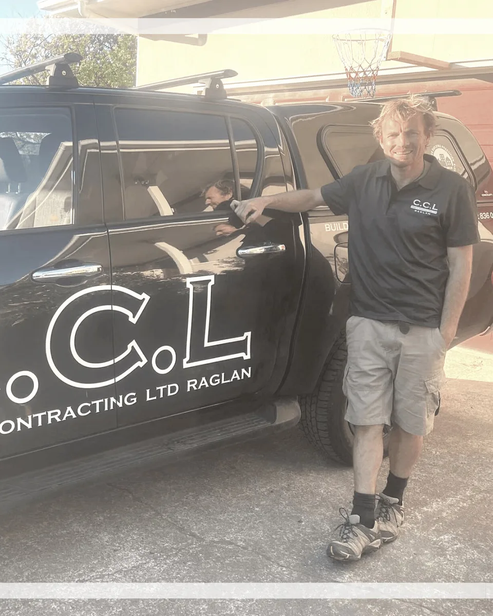 Carl 'Choppy', founder of Chops Contracting, beside the CCL ute in Raglan