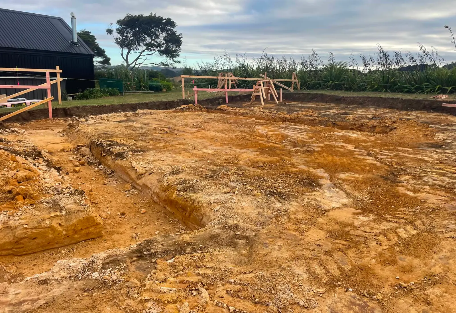 Site cut at the start of the build, with the foundation footprint marked out